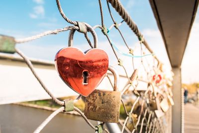 Padlocks hanging on footbridge