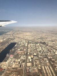 Aerial view of city and buildings against sky