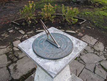 High angle view of clock on stone wall