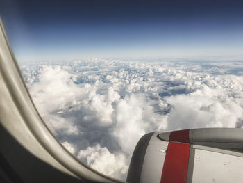 Aerial view of cloudscape seen from airplane window