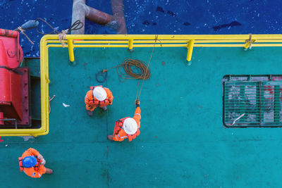 Offshore workers having a discussion prior to anchor handling activity at a construction work barge