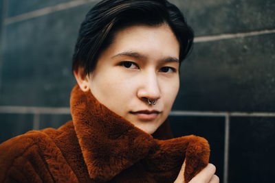 Close-up portrait of young woman during winter