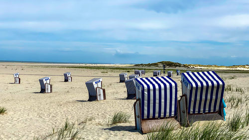 Hooded chairs on beach