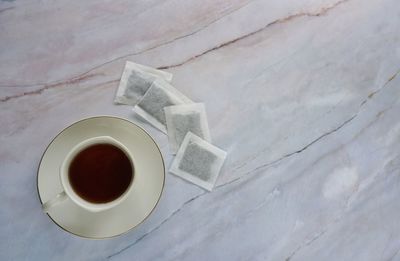 High angle view of coffee cup on table