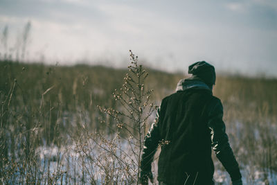 Rear view of a man on grass