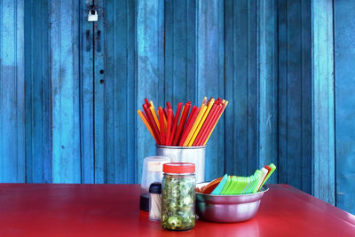 Close-up of multi colored pencils on table