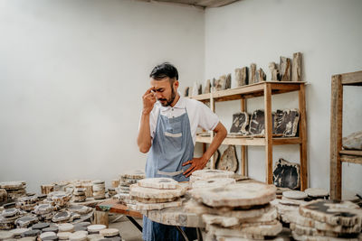 Side view of man working at home