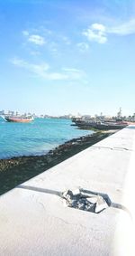 Scenic view of sea against blue sky