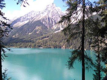 Scenic view of lake and mountains against sky