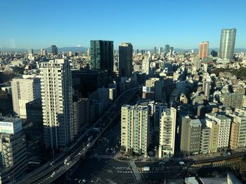 Aerial view of modern buildings in city against sky