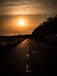 Road against sky during sunset