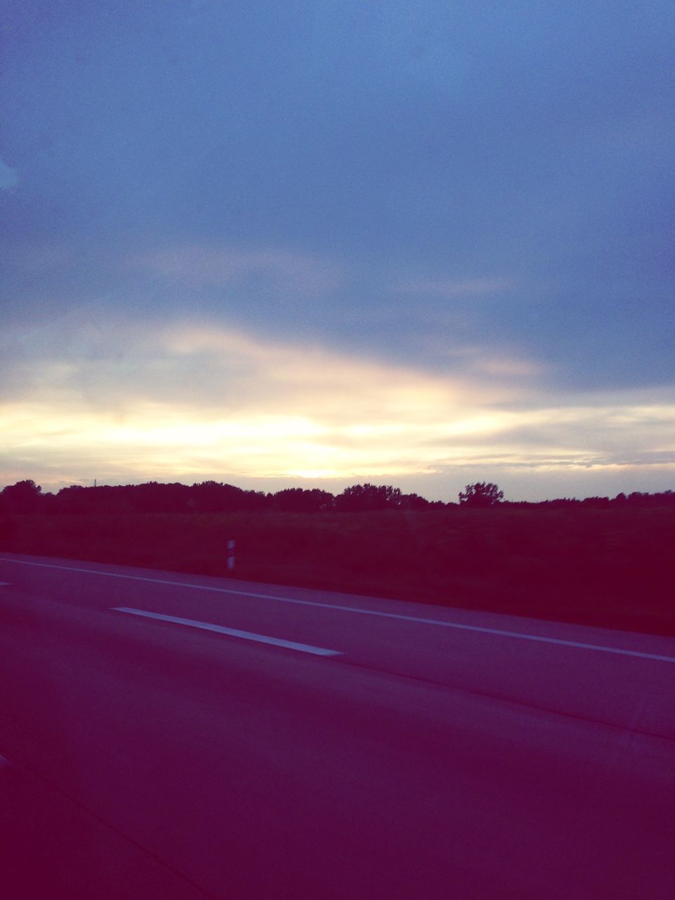 sky, road, sunset, landscape, tranquil scene, cloud - sky, transportation, tranquility, the way forward, silhouette, scenics, cloud, dusk, beauty in nature, nature, country road, tree, street, field, outdoors