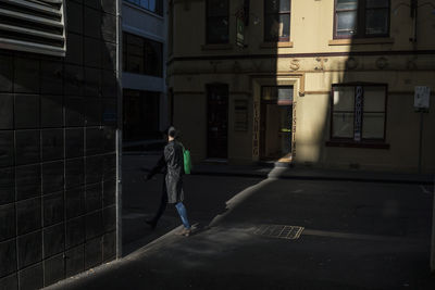 Woman standing in front of building