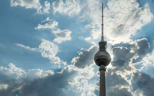 Low angle view of communications tower against sky