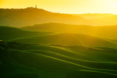 Scenic view of landscape against sky during sunset