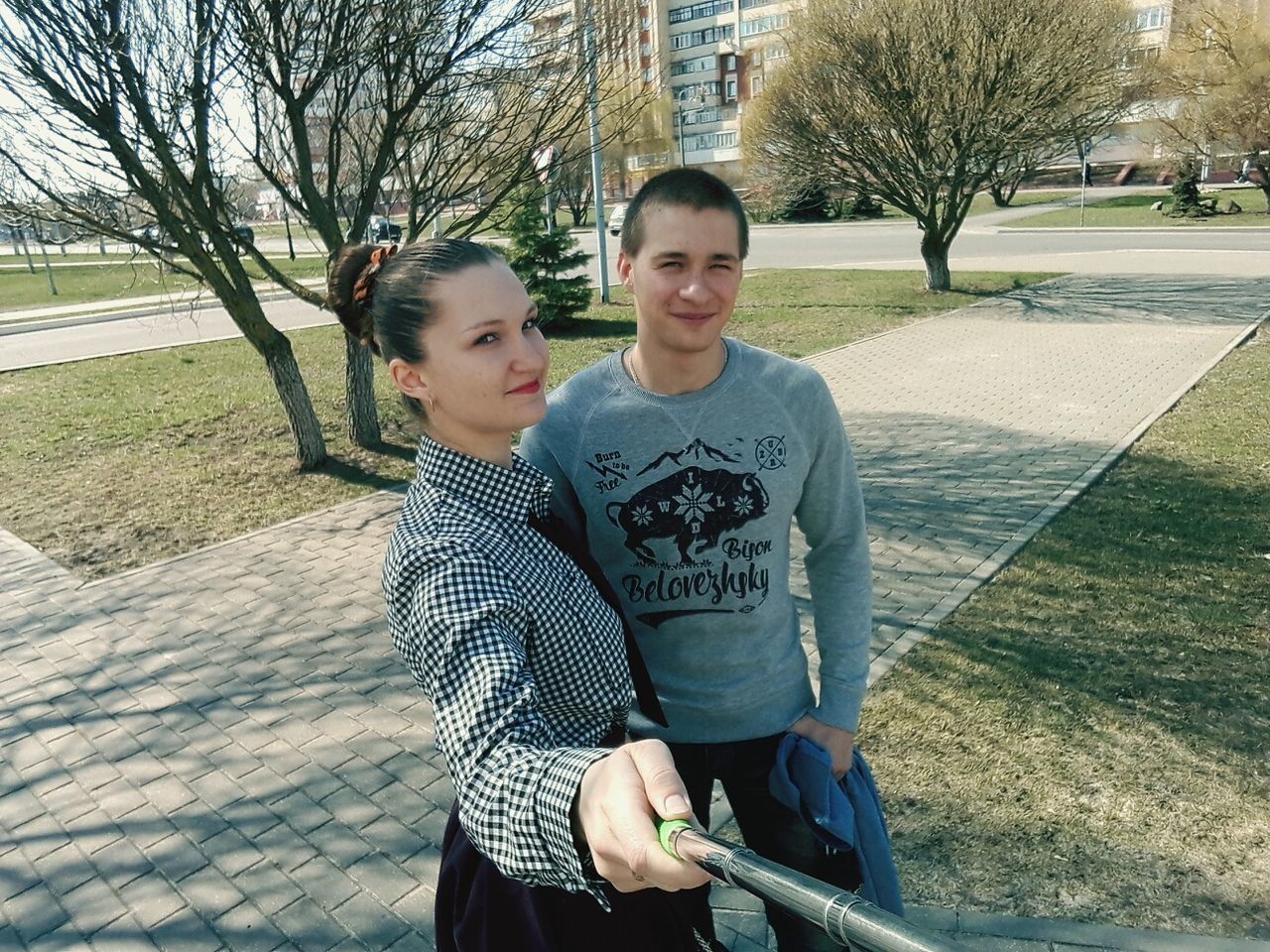 two people, looking at camera, childhood, togetherness, boys, portrait, bonding, love, park - man made space, son, outdoors, family, leisure activity, happiness, lifestyles, smiling, people, care, real people, day, tree, baseball - sport, adult, human body part