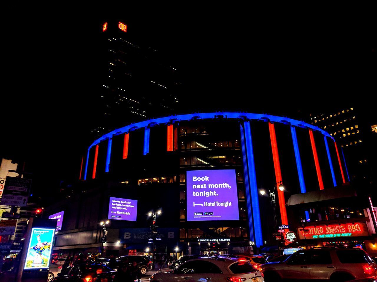 VIEW OF ILLUMINATED BUILDINGS AT NIGHT