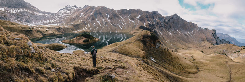 Panoramic view of snowcapped mountains against sky
