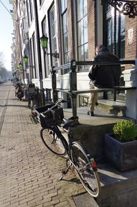 Man with bicycle in city