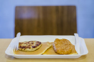 Fresh breakfast served in tray on table