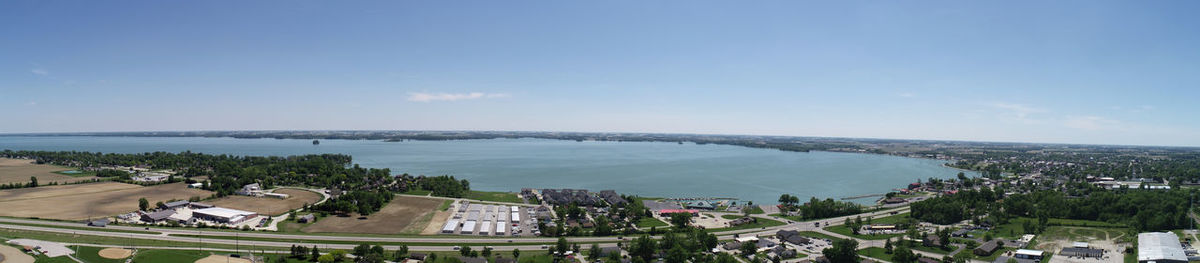 High angle view of buildings and sea against sky