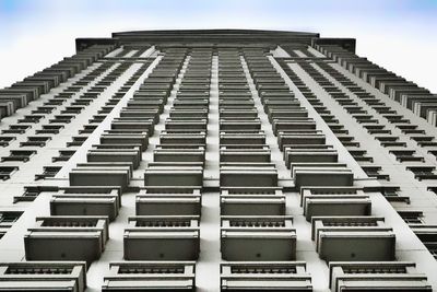 Low angle view of office building against sky