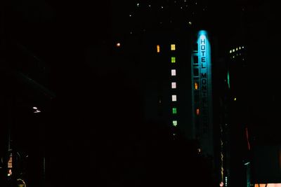 Illuminated ferris wheel at night