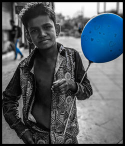 Portrait of young man standing outdoors