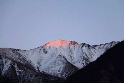 Scenic view of snowcapped mountain against clear sky