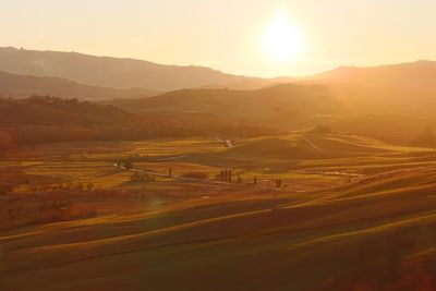 Scenic view of landscape against sky during sunset