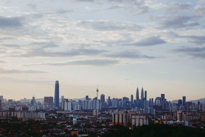 Modern buildings in city against sky