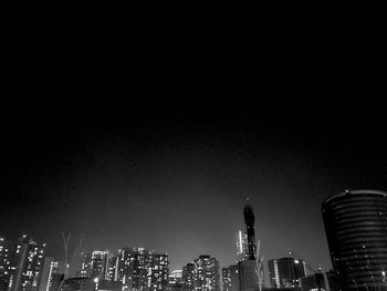 Illuminated buildings in city at night