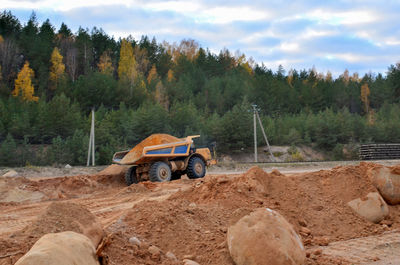 View of machine and cars on road