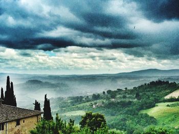 Scenic view of sea against storm clouds