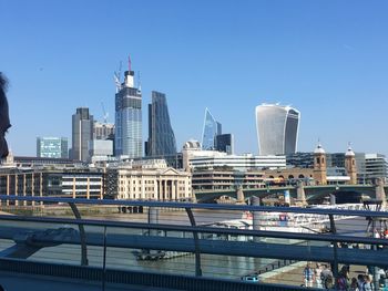 Modern buildings in city against clear sky