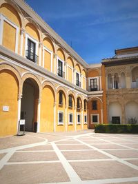 Exterior of historic building against blue sky