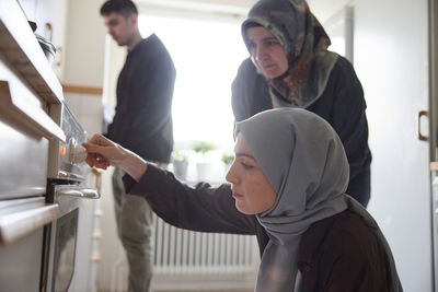 Family cooking together for eid al-fitr at home