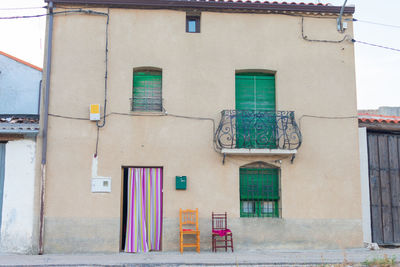 A abandoned and dilapidated stone house facade