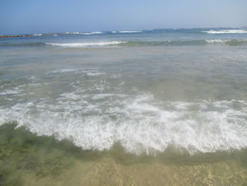 Scenic view of beach and sea against sky