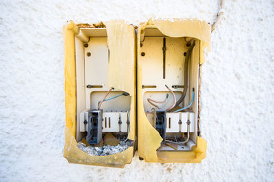 Close-up of electric lamp on wall