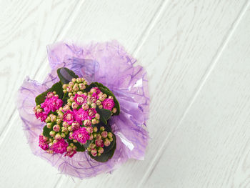 High angle view of pink flower on table