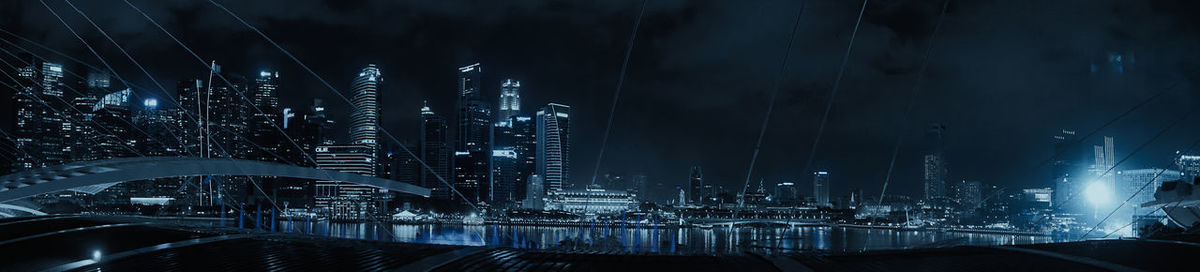 Illuminated modern buildings in city at night