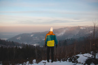 Climbing a mountain in the alps and enjoying the view of a valley in the austrian western alps.