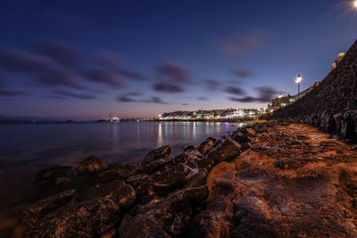 Panoramic view of sea against sky at night