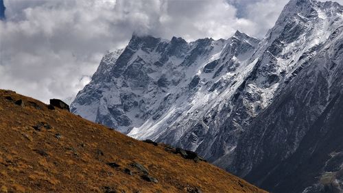 Scenic view of snowcapped mountains against sky