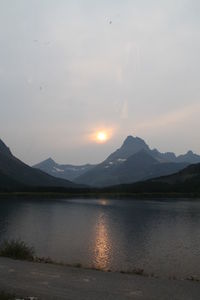 Scenic view of lake at sunset