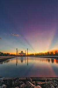 Scenic view of lake against sky during sunset