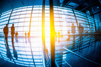 Reflection of people on glass window