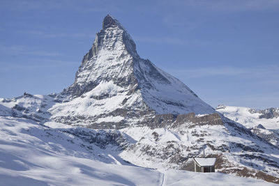 Scenic view of snow covered mountains