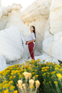 Portrait of girl standing on rock